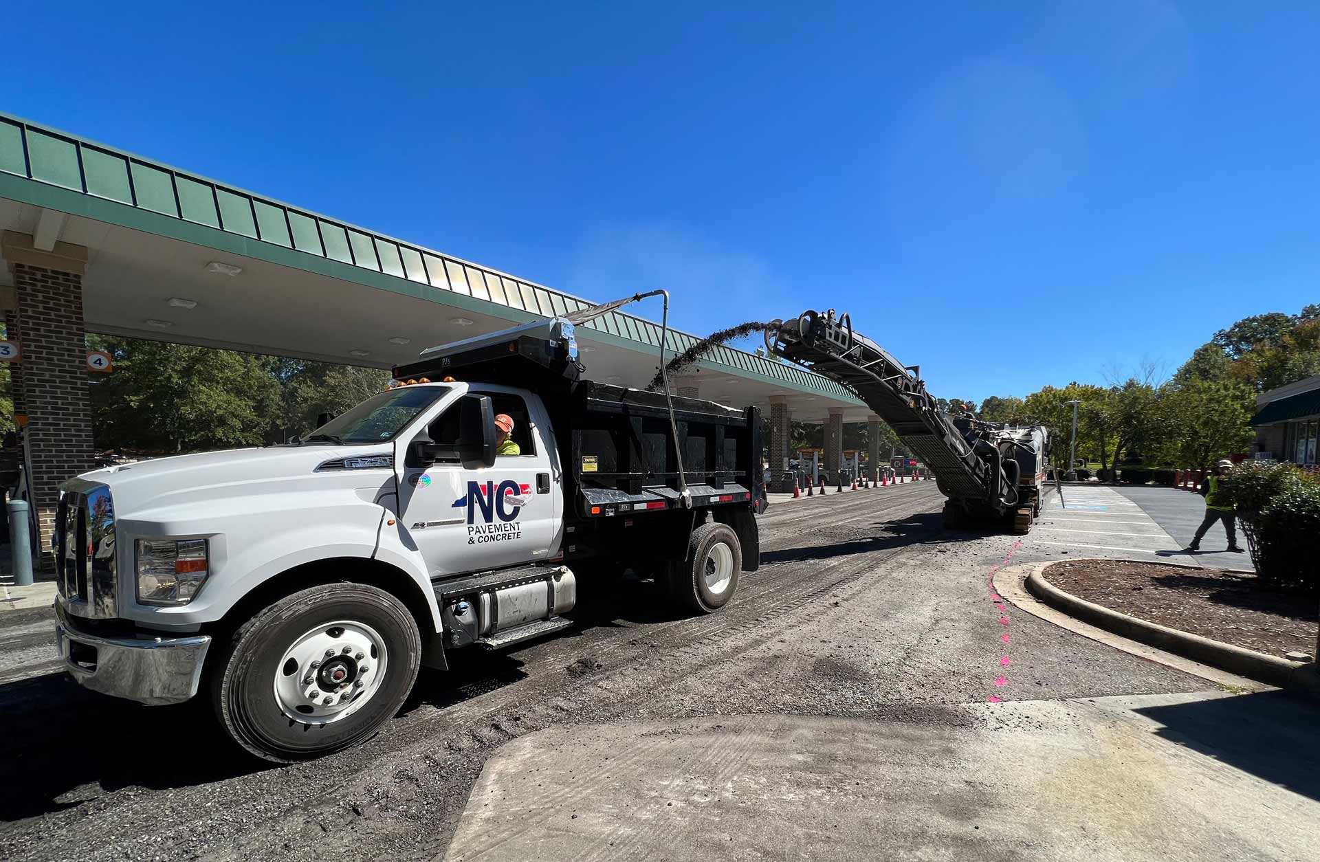 contractor repairing concrete at gas station in Raleigh